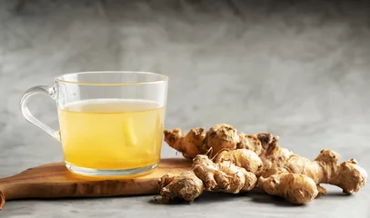 Tuinposter Fresh ginger and ginger tea © mnimage