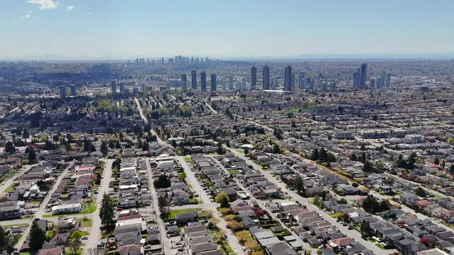 Panoramic aerial drone view of the skyline of Burnaby during a spring season in British Columbia, Canada