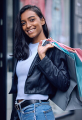 Portrait, smile and woman with shopping bag in city at mall for fashion, sales and discount at...