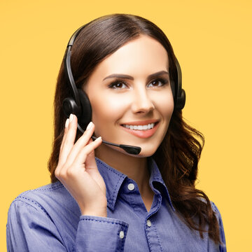 Contact Call Center Service. Customer support, sales agent. Caller answer phone operator or businesswoman. Looking up business woman in headset at studio. Isolated yellow background. Square image