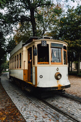 Street view with the famous retro tourist streetcar tram in the old town of Porto, Portugal....