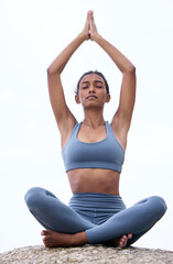 Beach, prayer hands and Indian woman doing yoga for spiritual chakra, meditation or wellness. Health, healing and female yogi person for pilates exercise, mindfulness or balanced chi by seaside