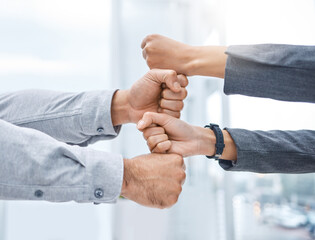Business people, hands and fist for teamwork, collaboration and partnership for solidarity and support in career. colleagues or employees and gesture for success, motivation and unity for project