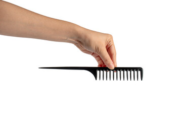 Black hair comb in hand isolated on transparent background