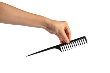 Black hair comb in hand isolated on transparent background