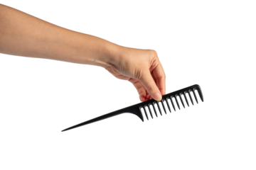 Black hair comb in hand isolated on transparent background
