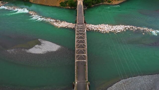 Turquoise Waters of Mat River Flow Beneath the Ancient Historic Arched Bridge: An Important Engineering Marvel
