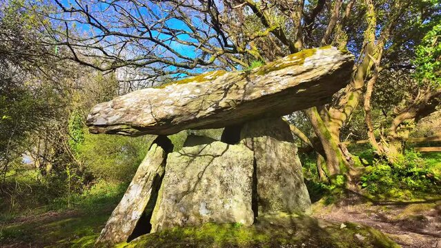 Timelapse shimmering shadows atmospheric light and blue sky in an place of the ancestors Gaulstown Dolmen in Waterford Ireland