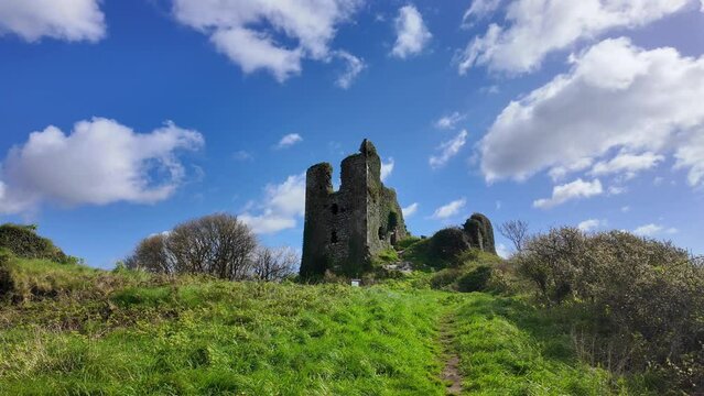 Castle ruins on the hill,historic site Dunhill Castle Waterford Ireland historic past and now a tourist attraction in rural idyllic landscape