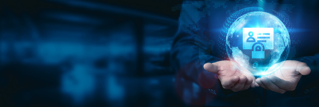 Businessman hold global information security globe with network connected to secure data centers and cybersecurity systems. Business development technology to safeguard sensitive information.