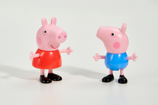 Figurines of Peppa Pig and George in studio