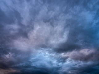 Naklejka na ściany i meble Dark blue moody sky clouds background overcast storm thunderstorm rainy weather gray