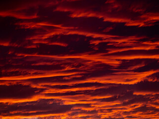 Fire stormy burning dramatic sky clouds twilight evening magenta red sunset dark moody overcast - Powered by Adobe