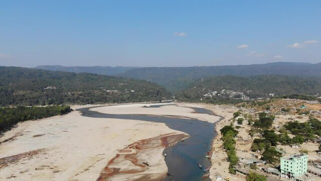 Aerial video drone shots of the Bangladesh landscape with lush green foliage, trees and the river