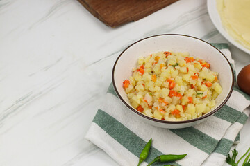 Ragout sayur for risoles filling, Indonesian traditional snack made from potato, carrot, and wrapped with soft crepe skin, bread crumbs and deep fry.  