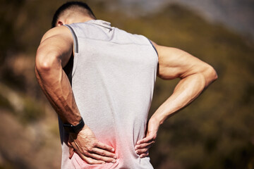 Man, runner and back pain in nature, ache and hurt outdoors on exercise or workout and accident....