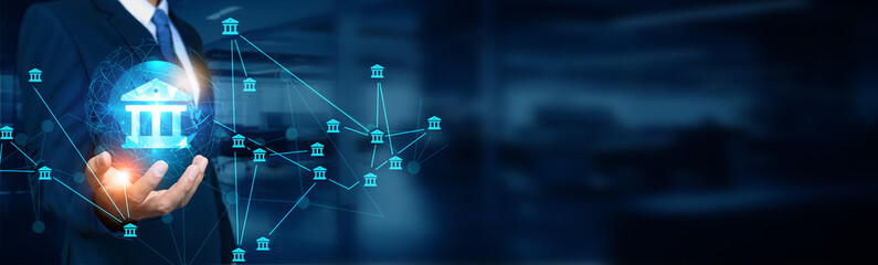 Banker holding global structure networking and banking connection, financial transactions, online banking services, investment banking, and social network.