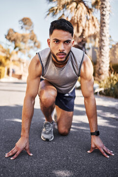 Sport, runner and man for fitness in outdoors for exercise, training and workout for health. Active, male person and athlete with marathon race on track for muscles, balance and cardio in street