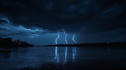 Night Thunderstorm: An image of a night thunderstorm, with lightning flashing across the sky and reflecting on a calm body of water below