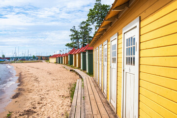 Beach cabins at a sandy beach - 789005675