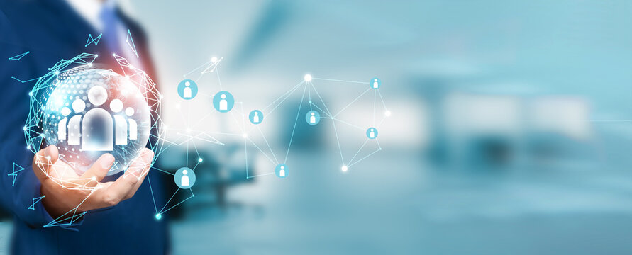 Businessman holds the circle of network structure, emphasizing the importance of customer relationship management (CRM) concept, strategy, and network for success in the modern business landscape.
