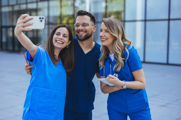Doctors, friends and selfie in hospital for team building, solidarity or diversity for social media post. Doctor, group and teamwork with black man, women and peace for comic smile, happy and support - 789006452