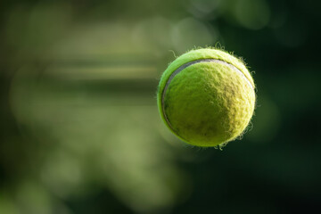 A tennis ball captured in the midst of flight