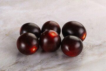 Raw ripe black kumato tomato