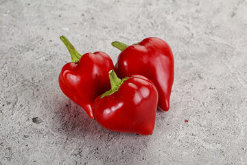 Red spicy cherry pepper heap
