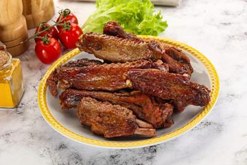 Roasted duck wings with sauce