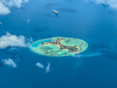 aerial landscape view of Feydhoofinolhu island located in Indian Ocean with beaches, buildings and infrastructure 