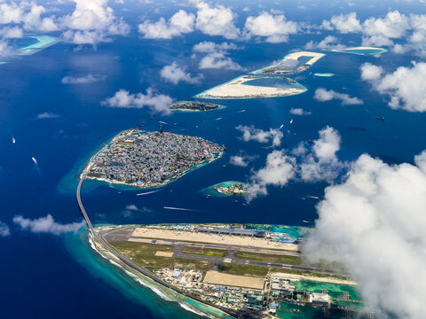 aerial landscape view of Mal&eacute; City,  the capital of Maldives with Sinamale Bridge as connection to Hulhule Island - Gulhi Falhu and Thilafushi in the background 