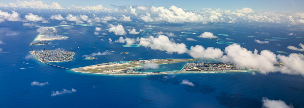 panoramic aerial landscape view of Mal&eacute; City,  the capital of Maldives with Sinamale Bridge as connection to Hulhule Island - Gulhi Falhu and Thilafushi in the background 