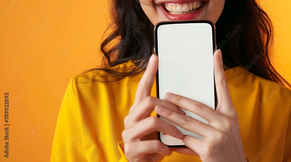 Leinwandbilder app ad smiling pretty woman holding smartphone with white blank device screen in hand close up to ca