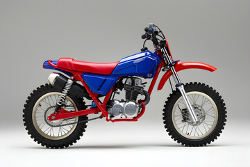 The Vibrant Red and Blue PW50 Off-Road Motorcycle Enhanced for Young Adventurers