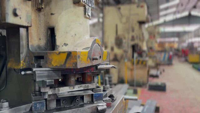 Industrial hydraulic press in massive factory, close up view