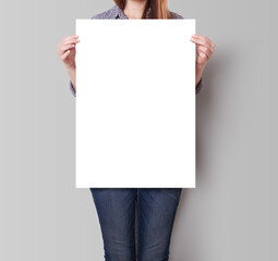 A Woman Holding an Empty Poster Mockup