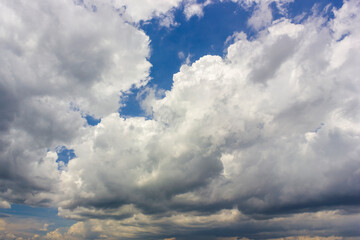 Obraz premium Ornamental clouds. Dramatic sky. Epic storm cloudscape. Soft sunlight. 