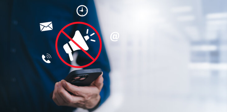 Businessman using smartphone touch mute icon on virtual screen. Blog blog speak talk advertising presentation,Voice recognition, speech detection and deep learning application,Voice Assistance
