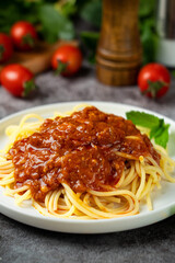 Traditional pasta spaghetti in plate on table.