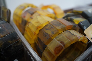 Bracelets made of carved amber on display