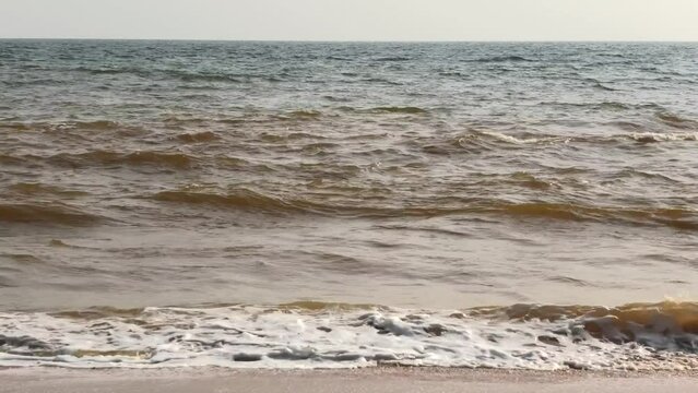 The foam of turbulent wave on the beach at Veli, Thiruvananthapuram, Kerala, India