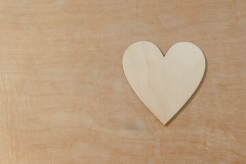 Photo of wooden heart design, showing empty space love gesture.