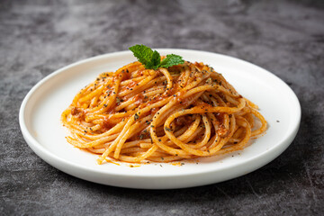 Traditional pasta spaghetti in plate on table.