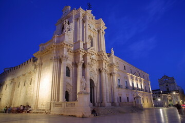 Fototapeta na wymiar Piazza del Duomo (Duomo Square), with the Duomo Cathedral, Ortigia Island, Syracuse, Sicily, Italy. Picture taken in the evening at blue hour