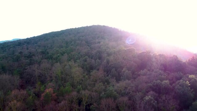 Rising to the top of a Volcano: the Inactive Santa Margarida Volcano. Sunrise Glimpse of the Massive Crater in the Earth Located in Catalonia Spain. Forested Ruins in the Pyrenees Mountain Ranges.