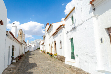street with houses of traditional architecture in the medieval village of Evoramonte, Alentejo....