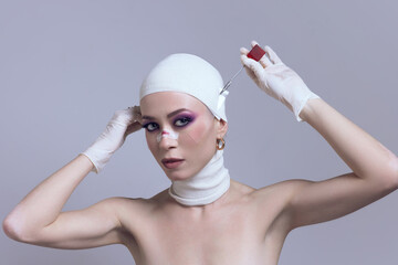 Woman with striking makeup unveiling bandage from face after plastic surgery on pastel purple...