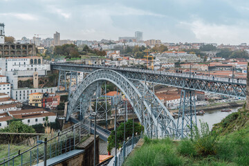 A close-up of the Dom Luís I Bridge in the old town of Ribeira, Porto, Portugal. Fragment of a metal railway bridge between Oporto and Nova Gaia
