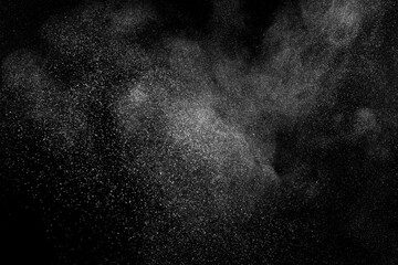 Obraz premium White texture on black background. Dark textured pattern. Abstract dust overlay. Light powder explosion. 